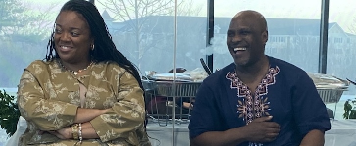 Two people smiling